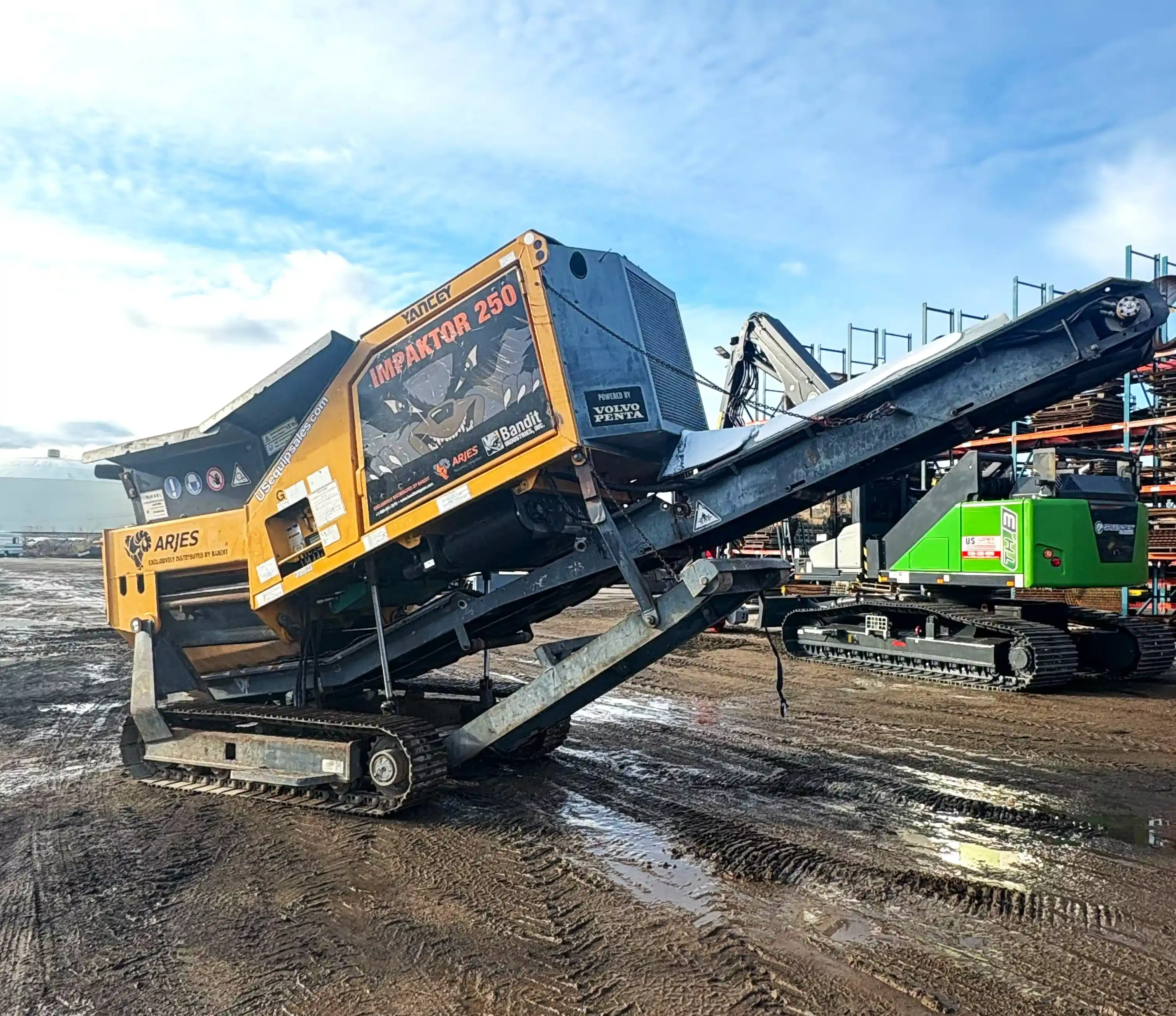 Arjes Impaktor 250 tracked mobile shredder with discharge conveyor, designed for concrete, asphalt, and waste recycling.