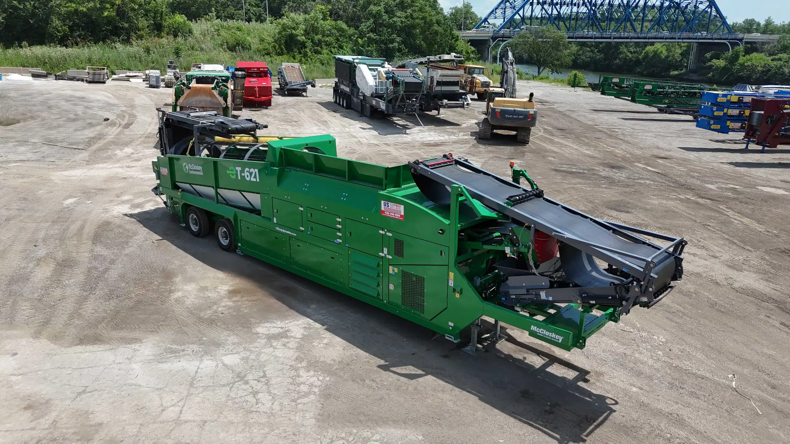 McCloskey T621 trommel screener staged in an equipment yard, designed for compost, soil, and aggregate screening.
