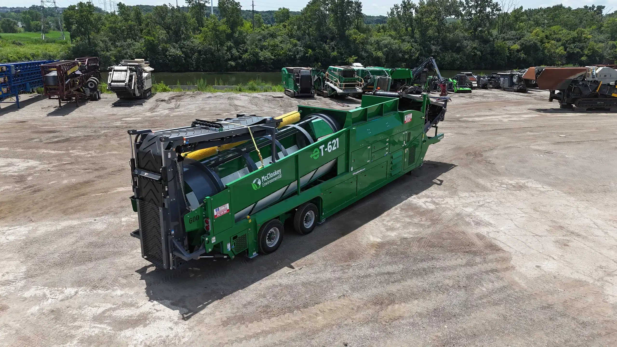 McCloskey T621 mobile trommel showing drum housing and discharge system for material separation.