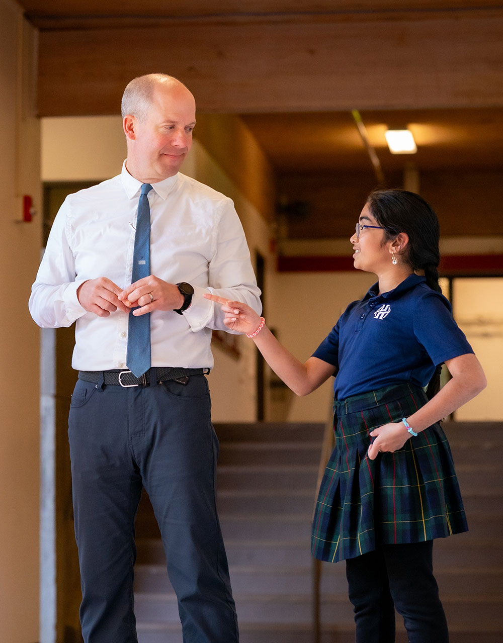 JP Culley, Head of School, talking with a student.