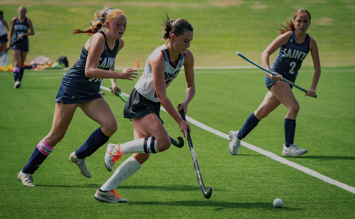 Field hockey players in action.