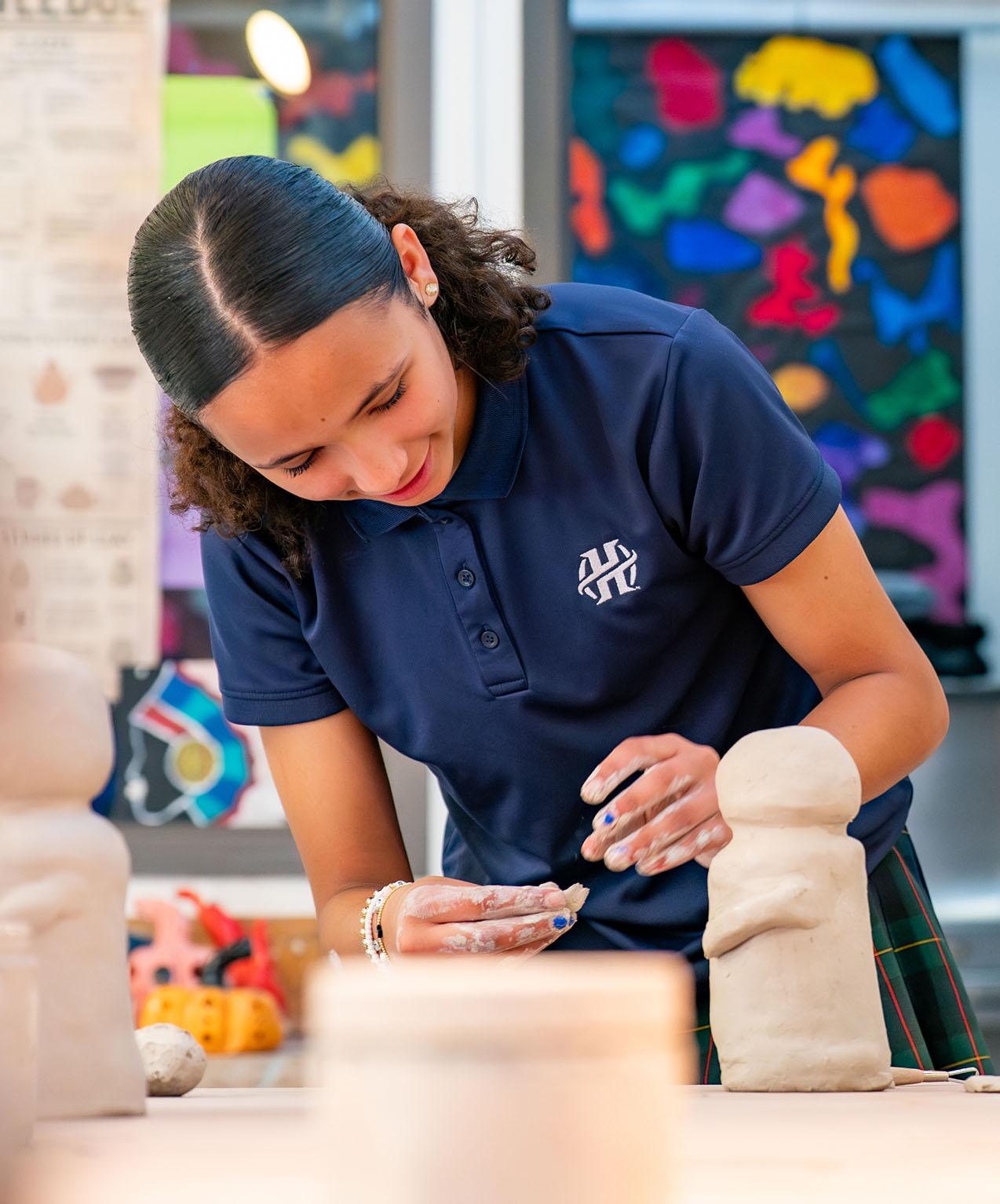 A student working with clay.