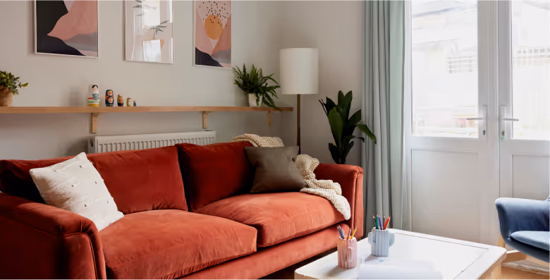 Cozy living room with red velvet couch