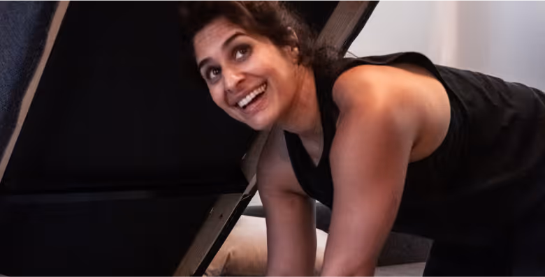 Woman smiling while volunteering for Furnishing Futures