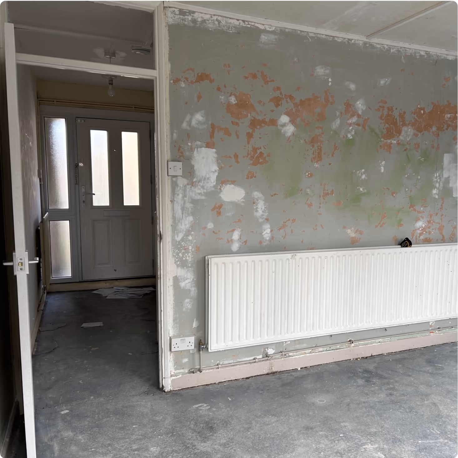 Photo of an empty and bare property with no flooring or paint on the wall