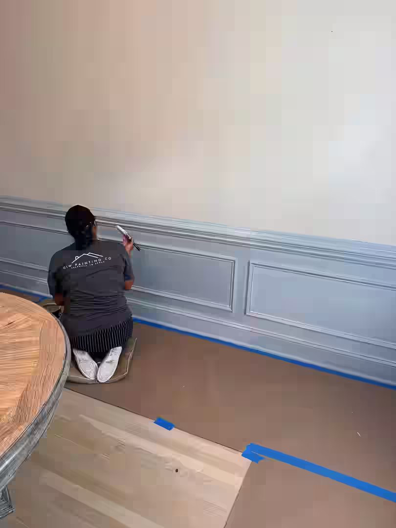 painter carefully preparing wall surface - painting company Charlotte NC painter carefully preparing wall surface - painting company Charlotte NC