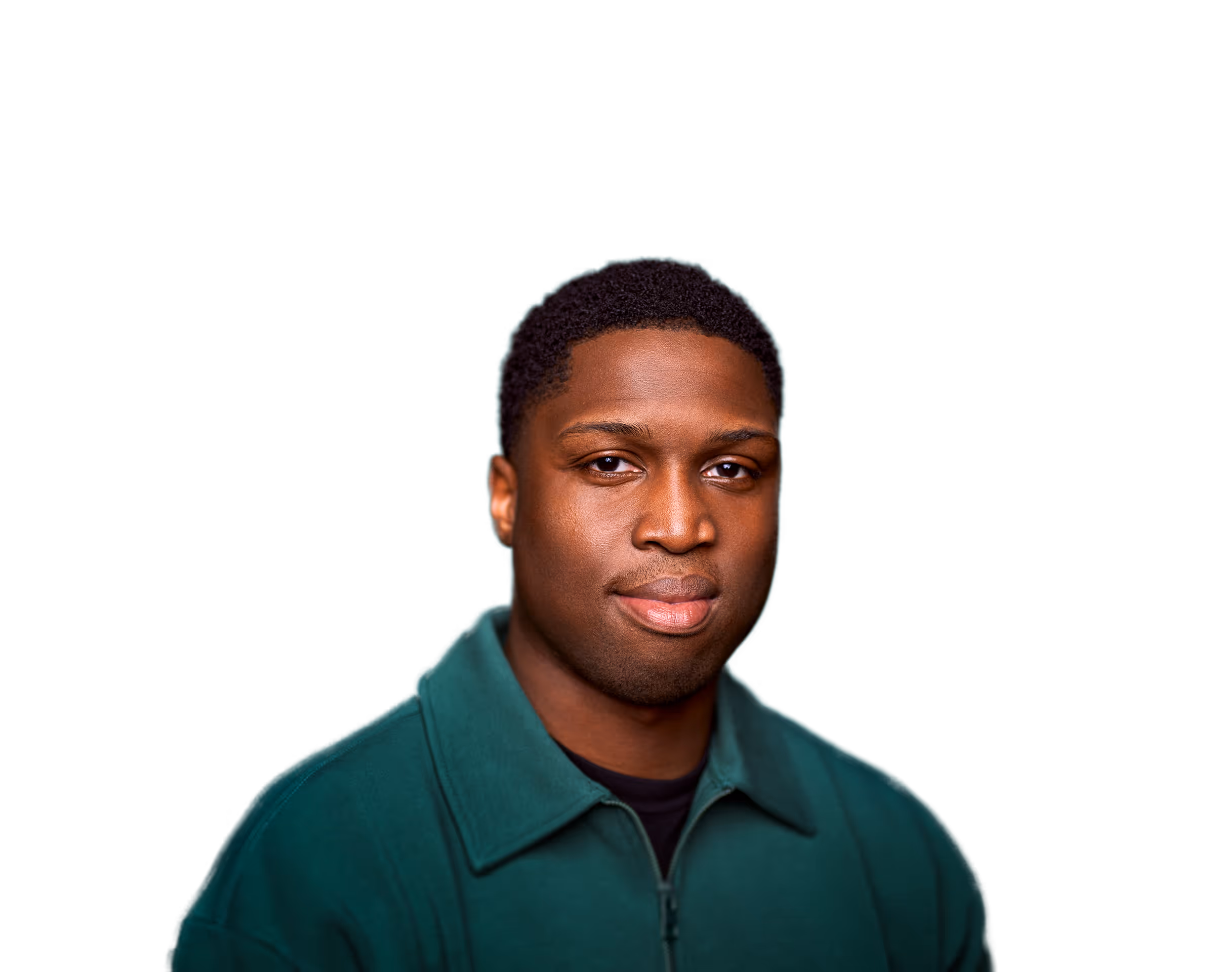 Portrait of a man with short curly hair wearing a dark green zip-up jacket against a plain background.