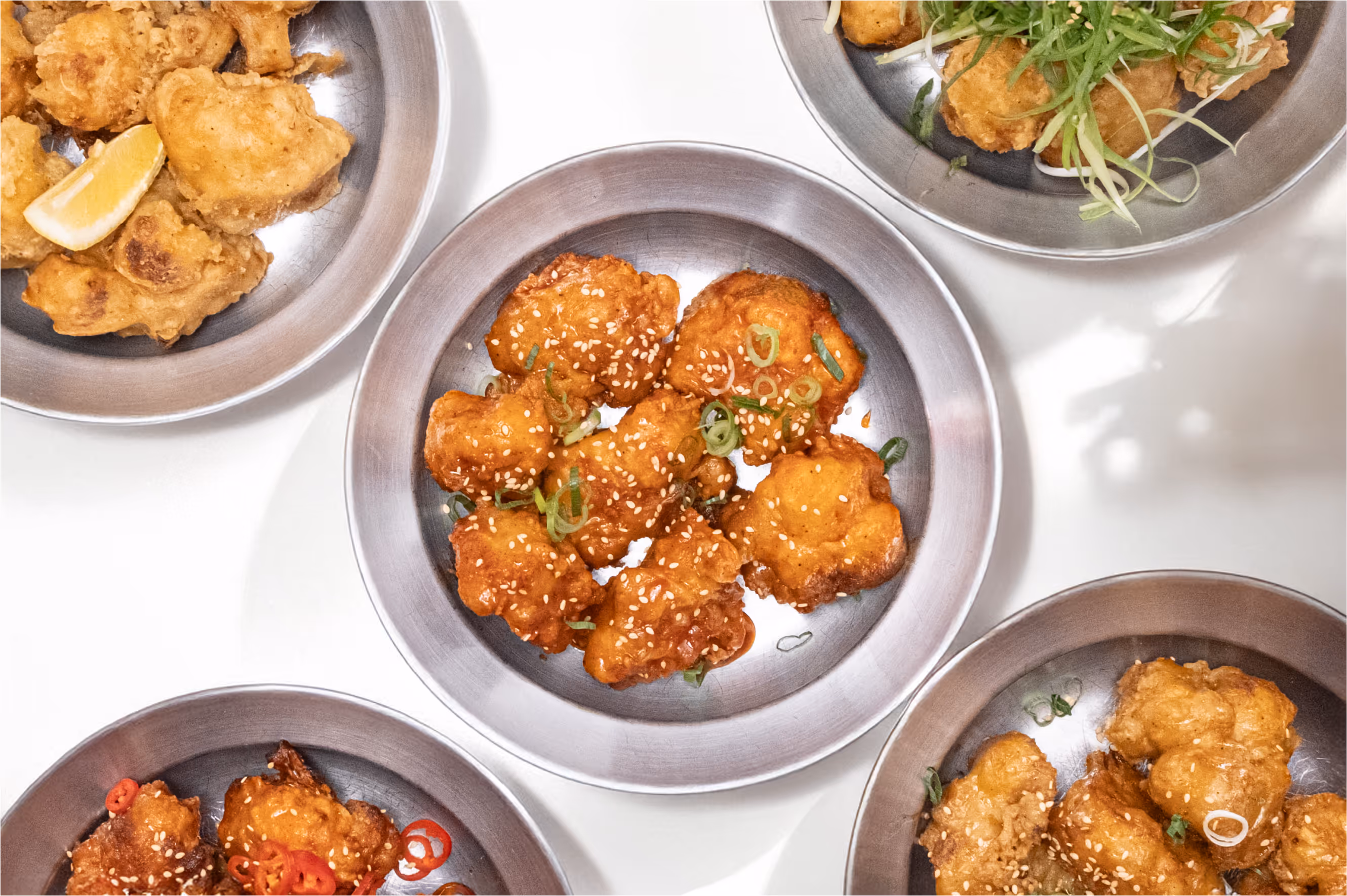 All the styles of panned or unpanned Fried Cauliflower served on metal plates