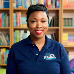 Florentine Ulysse smiling in Panthers school polo shirt