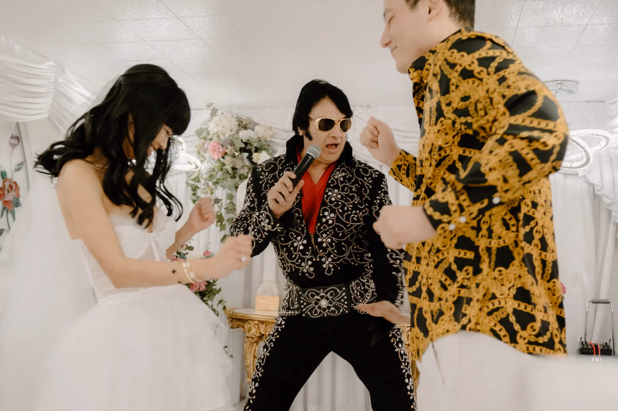 Dana and Matt's iconic Las Vegas chapel wedding, with Elvis officiating their glitzy, retro-inspired ceremony