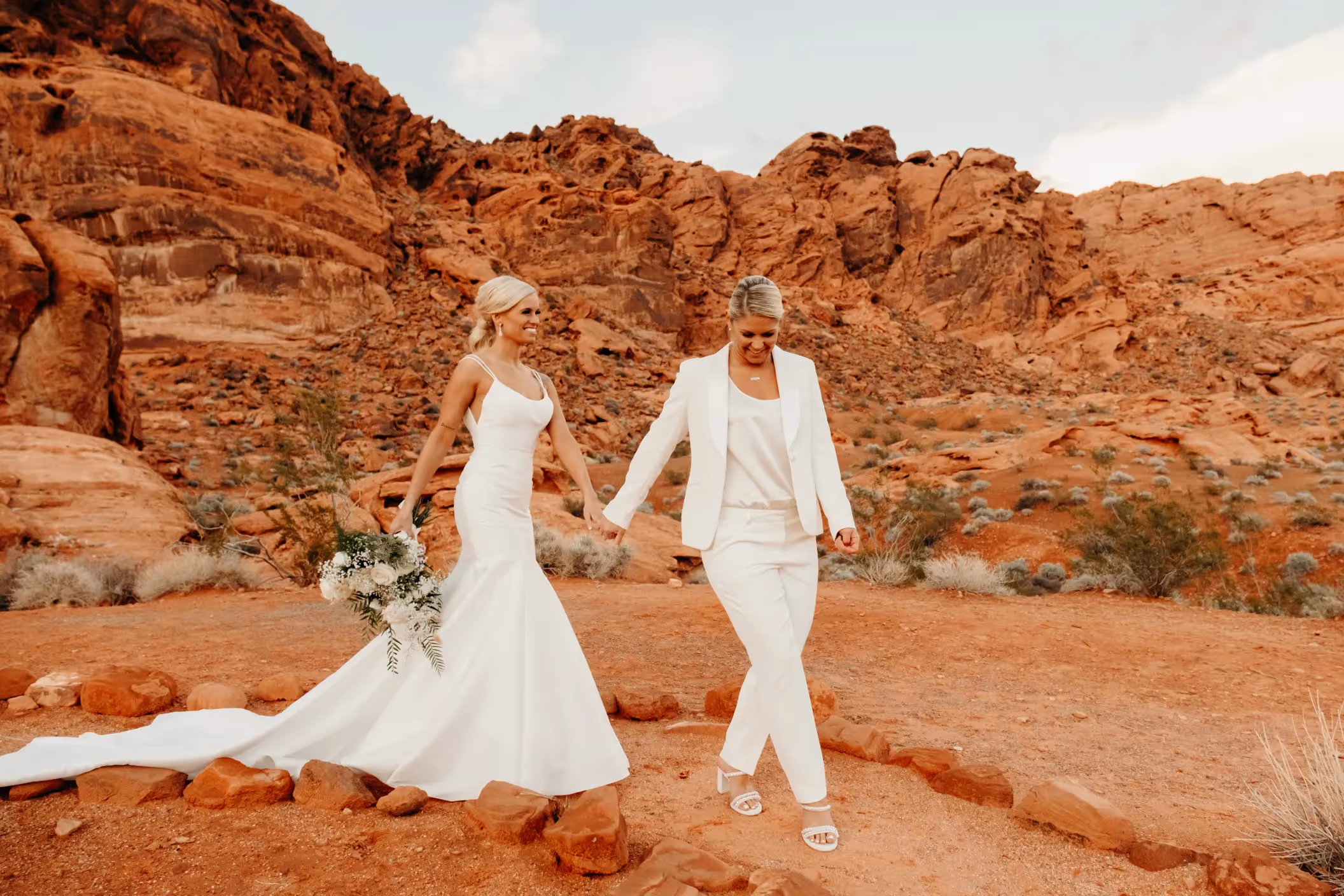 Emily and Johnny's intimate Las Vegas elopement at Valley of Fire, exchanging vows against a backdrop of towering red rock formations