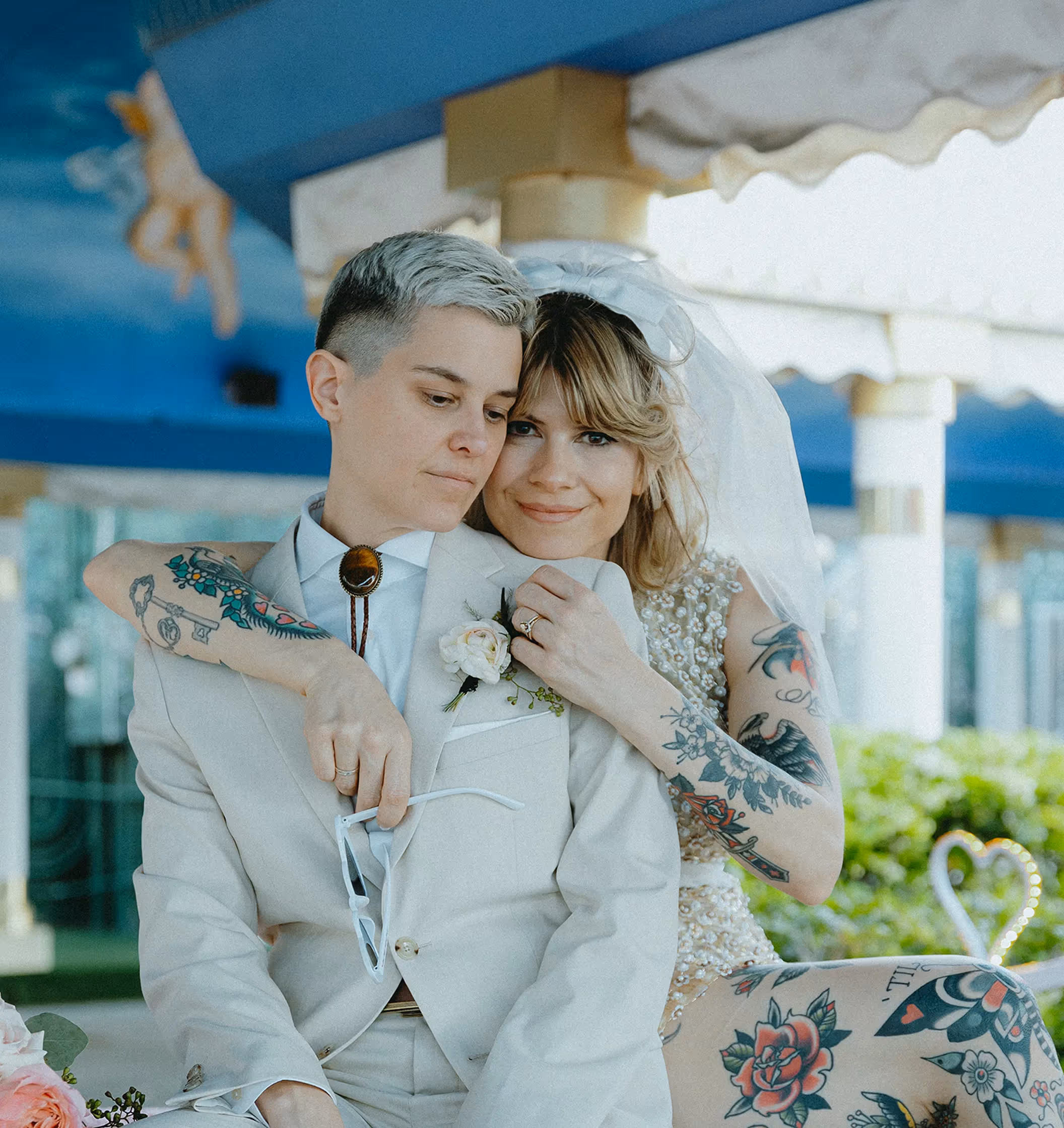 Christina and Joseph's joyful Las Vegas chapel elopement, bride laughing during ceremony in front of stained glass heart window