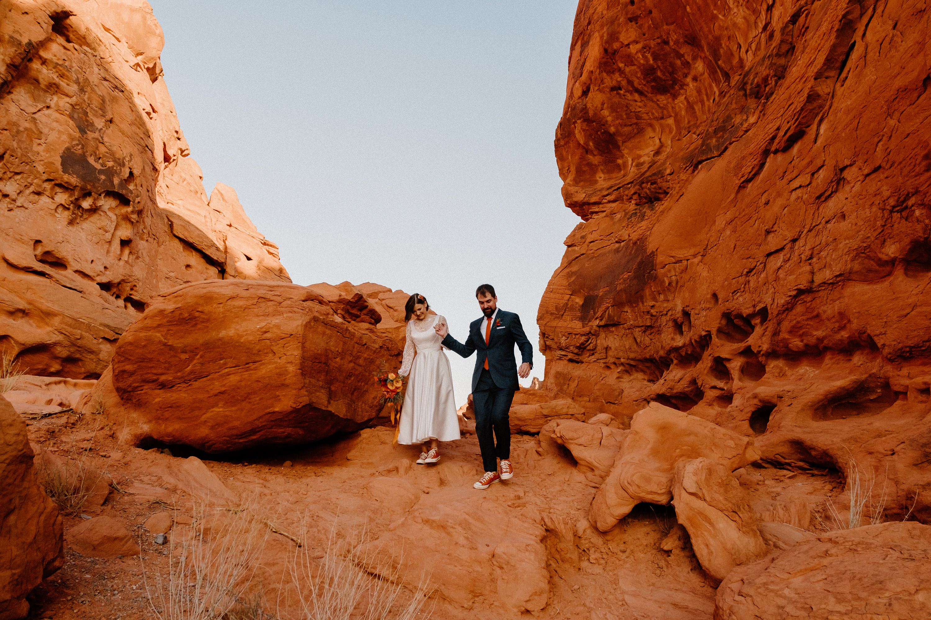 Kim and Connor's intimate Las Vegas elopement at Valley of Fire, posing in front of majestic red rock formations
