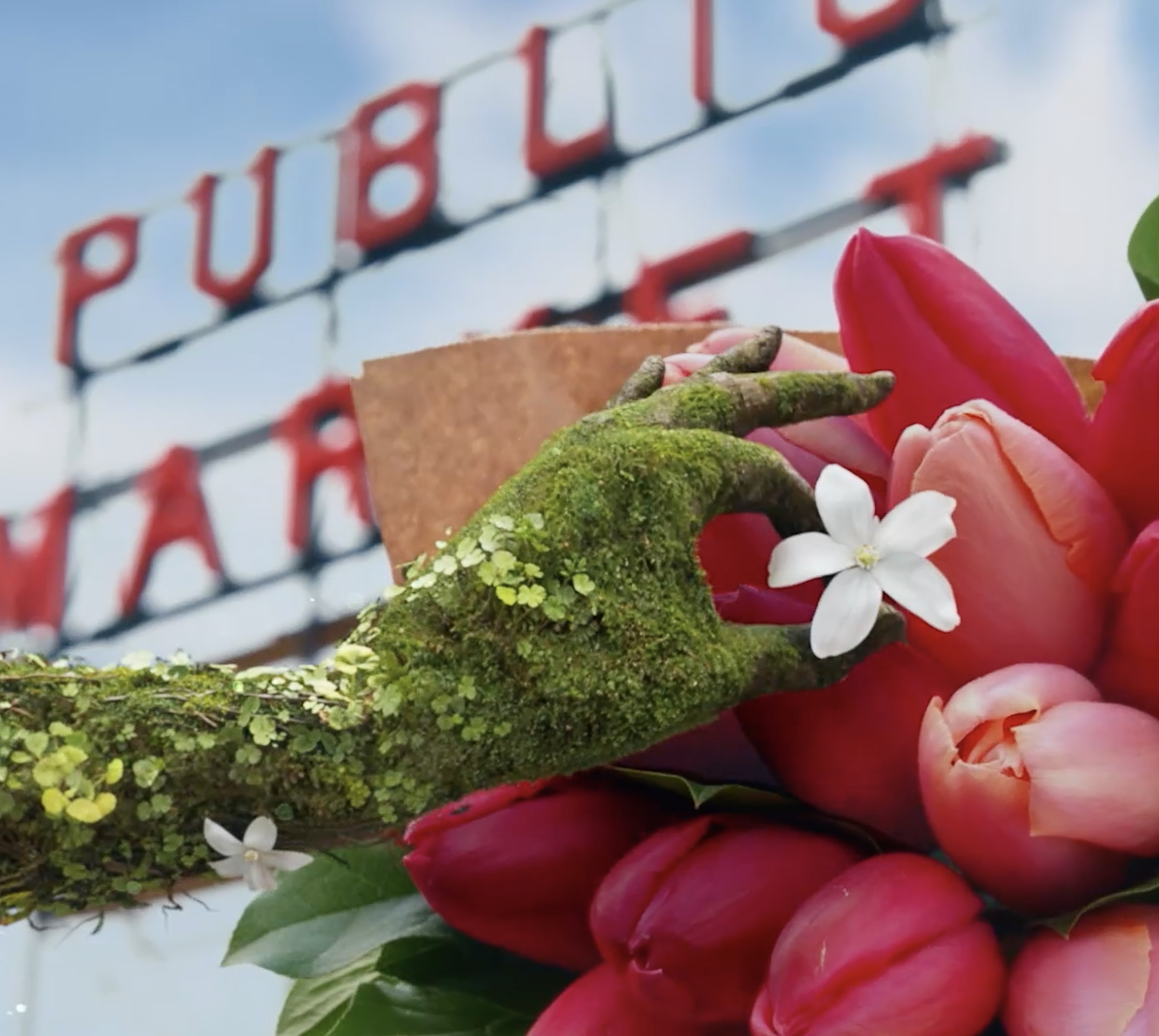 Retired WNBA legend Sue Bird and two others in beekeeping outfits tending to bees in a garden setting