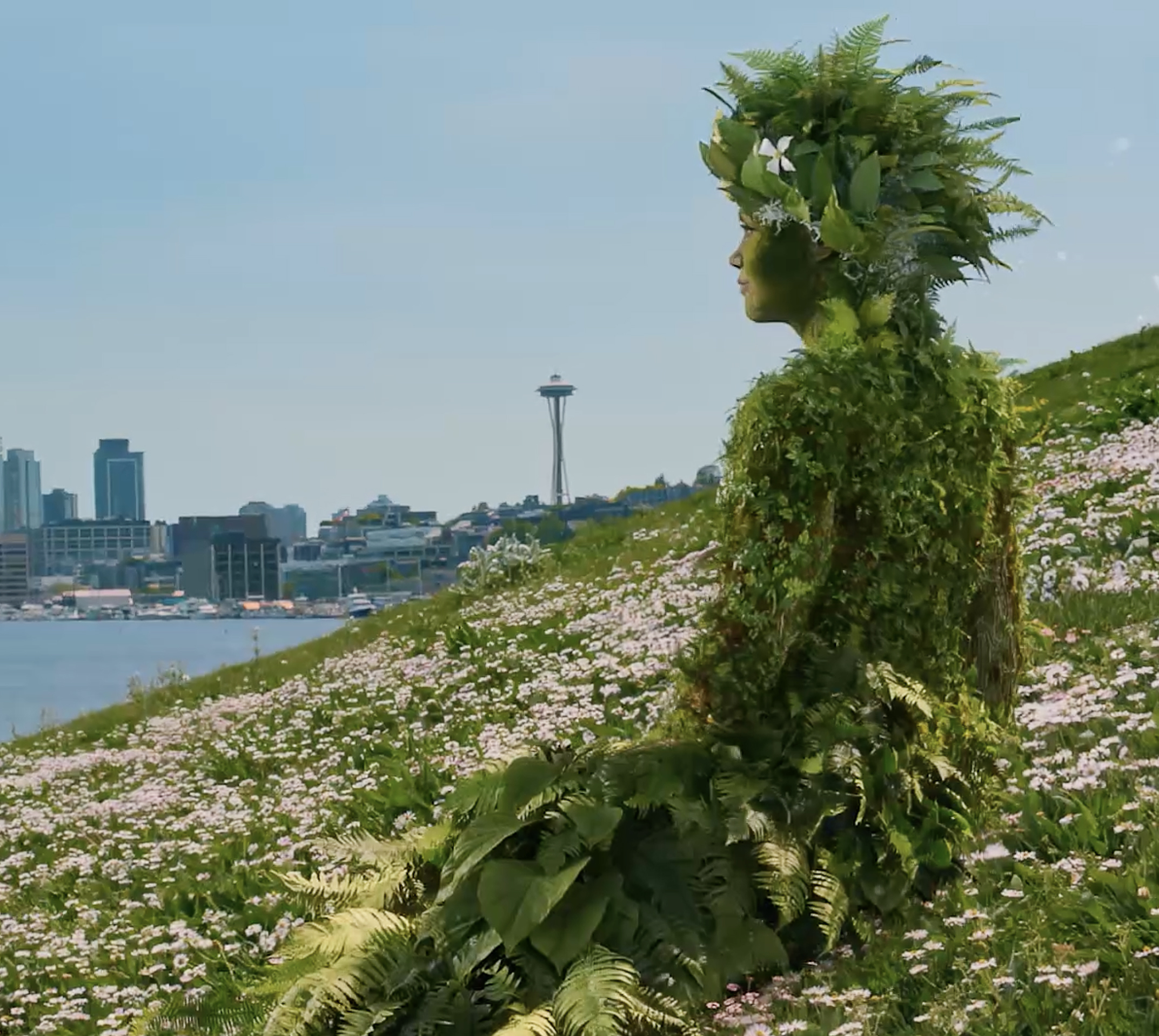 Retired WNBA legend Sue Bird holding on to rings on a ninja training course
