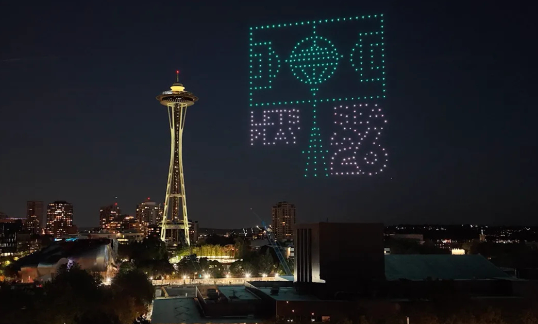 Drones near the space needle displaying Seattle's World Cup logo