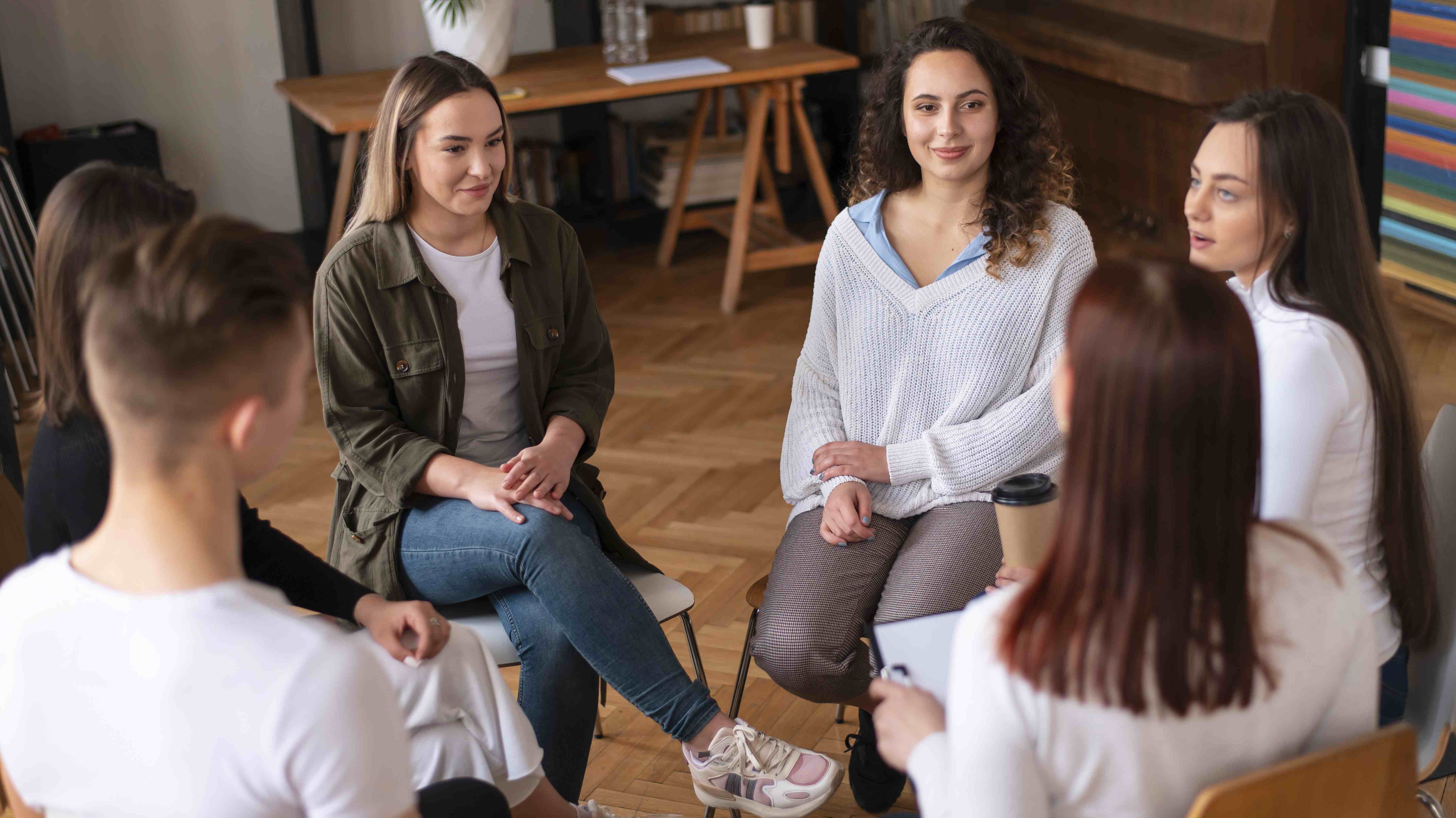 Group of people sitting in a circle