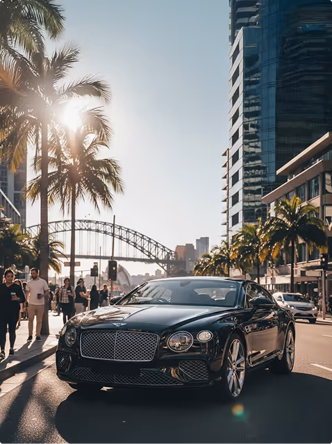 Professional black and white headshot of a Turba Media team member standing in front of large tropical leaves, wearing a dark shirt and looking confidently at the camera.