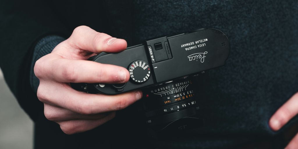 a person holding a camera in their hands