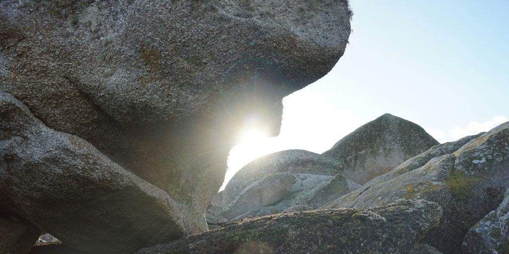 gray rock formation under white clouds during daytime
