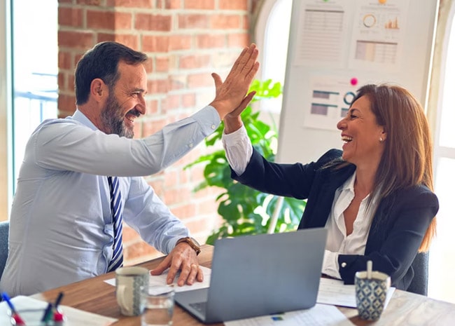professionals giving high fives