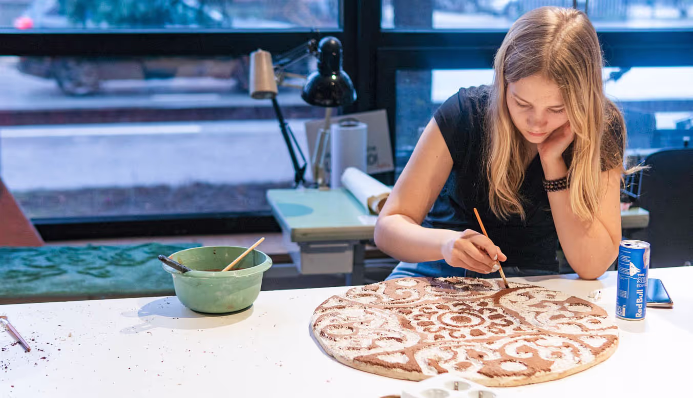 A student working with clay project