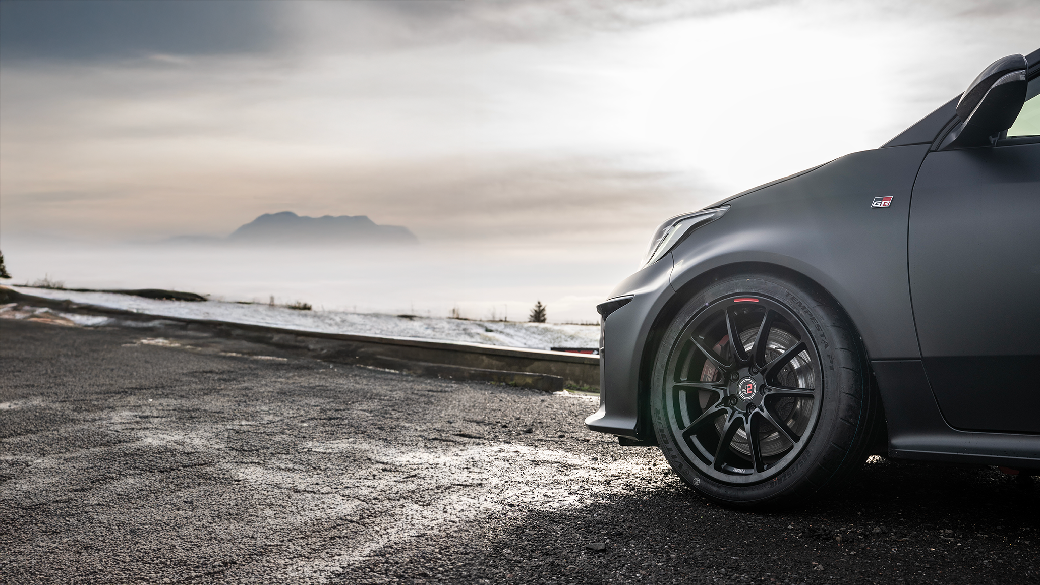 Race car on track with Vitour tyres
