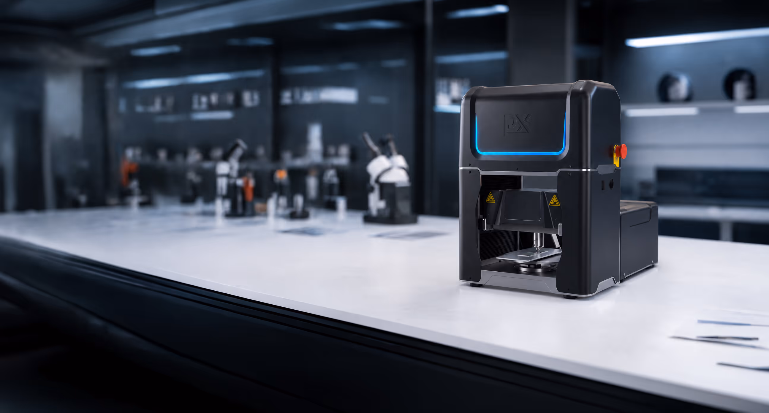 Modern black PX machine on white laboratory table with microscopes blurred in background.