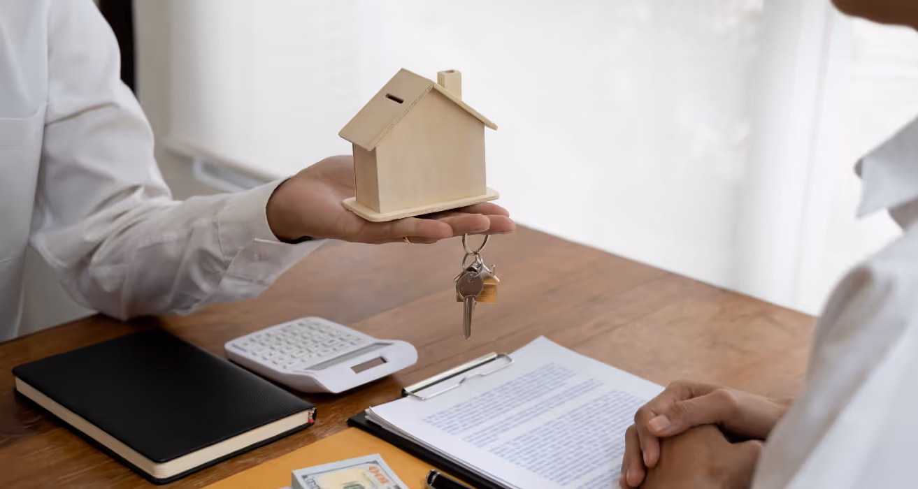 Homebuyer examining mortgage documents closely to uncover hidden fees and extra costs before signing loan agreement.