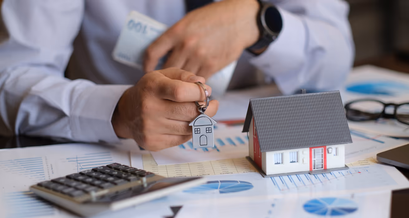 House keys being handed to new homeowners after escrow is closed on a residential property purchase.