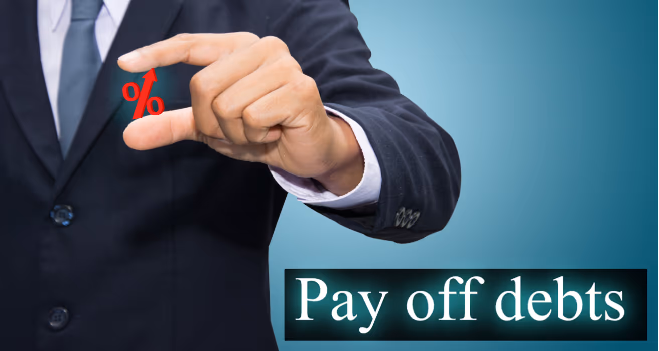 Businessman holding percent icon with 'Pay off debts' . symbolizing reducing high-interest debt.