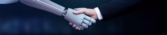 Human and robot shaking hands symbolizing AI collaboration and partnership in technology and innovation.