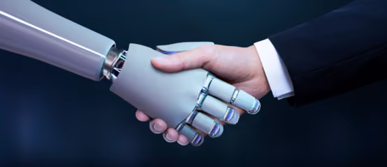 Human and robot shaking hands symbolizing AI collaboration and partnership in technology and innovation.