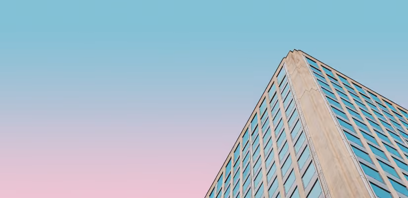 High-rise building against pastel sky, ideal for urban architecture or banking content.