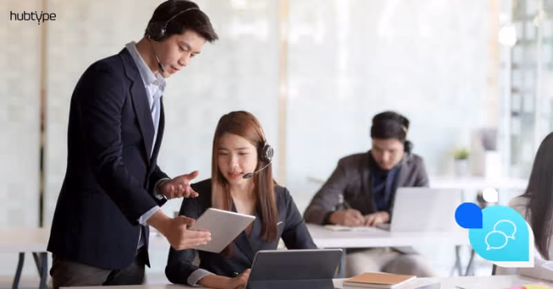 Customer service team using digital tools for communication management in modern office.