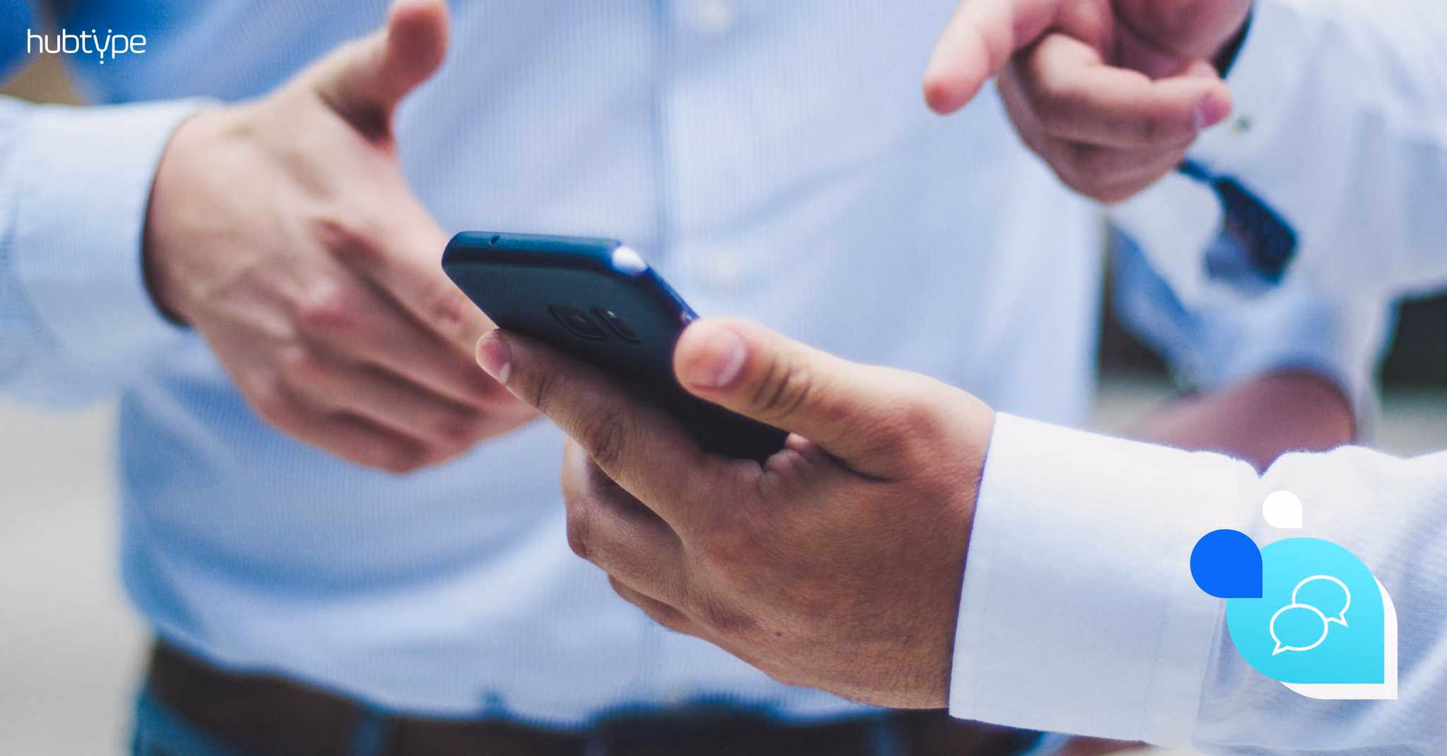Two people discussing and pointing at a smartphone, ideal for technology or communication articles.