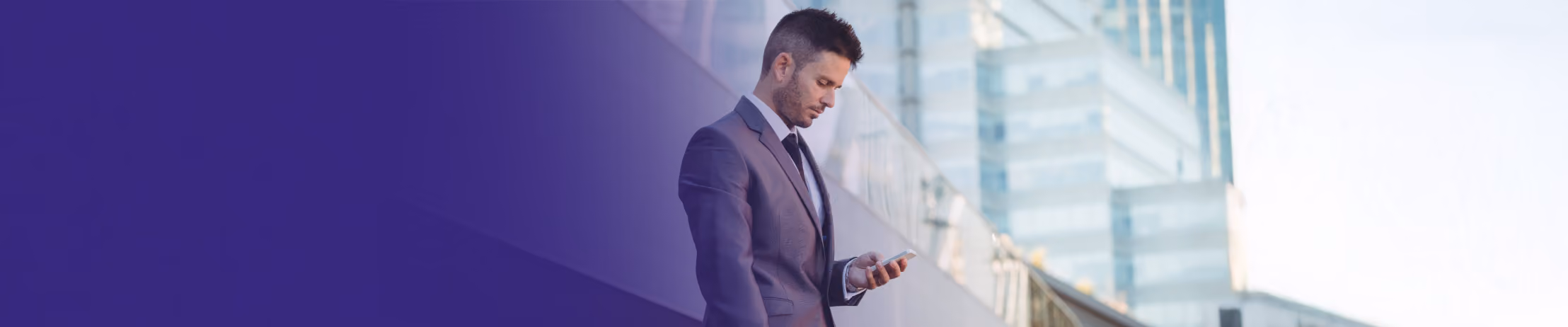 Professional businessman in dark suit checking smartphone near modern glass building with 'WhatsApp Webviews Explained' text