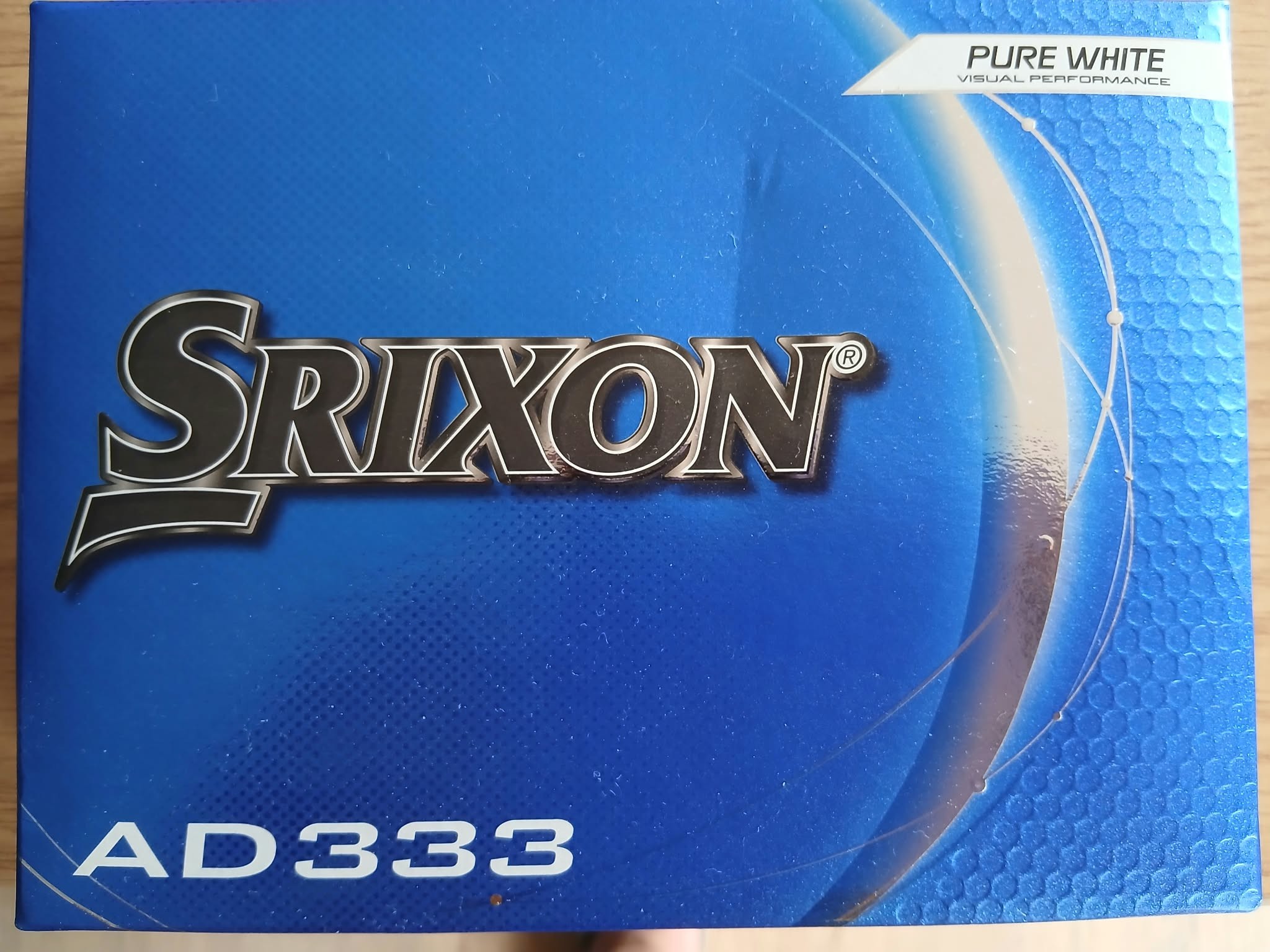 A box of 12 standard golf balls.