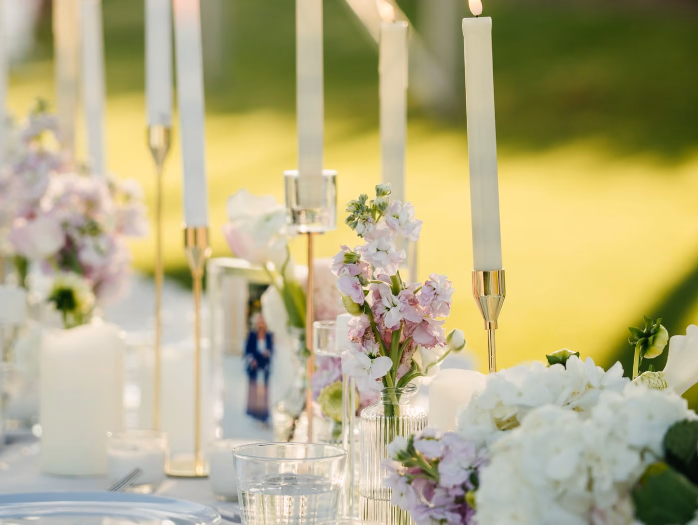 Candlelit wedding tablescape with pastel florals under the tent on Stewart's lawn