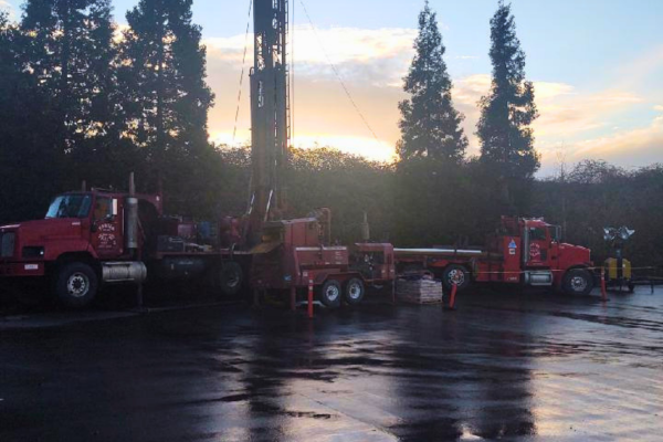 Hansen Drilling drill rig on wet hillside