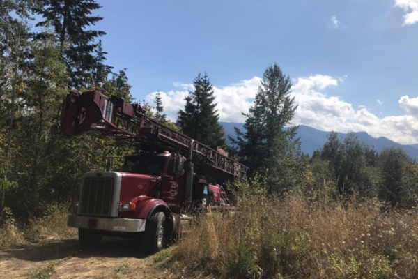 Hansen Drilling drill rig on wet hillside