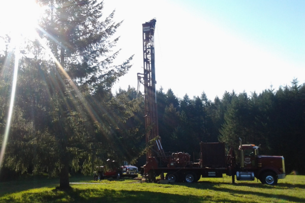 Hansen Drilling drill rig on wet hillside
