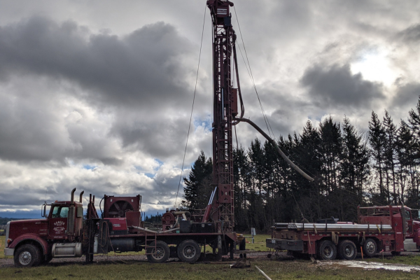 Hansen Drilling drill rig on wet hillside