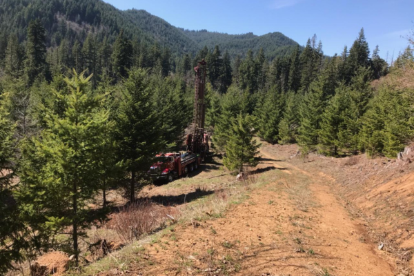 Hansen Drilling drill rig on wet hillside