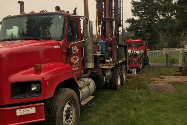Hansen Drilling drill rig on wet hillside