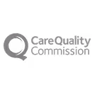 Logo of Care Quality Commission featuring a stylized gear symbol with a circle inside.