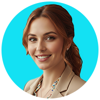 Portrait of a smiling woman with long, auburn hair pulled back into a low ponytail, wearing a tan blazer with a patterned blouse.