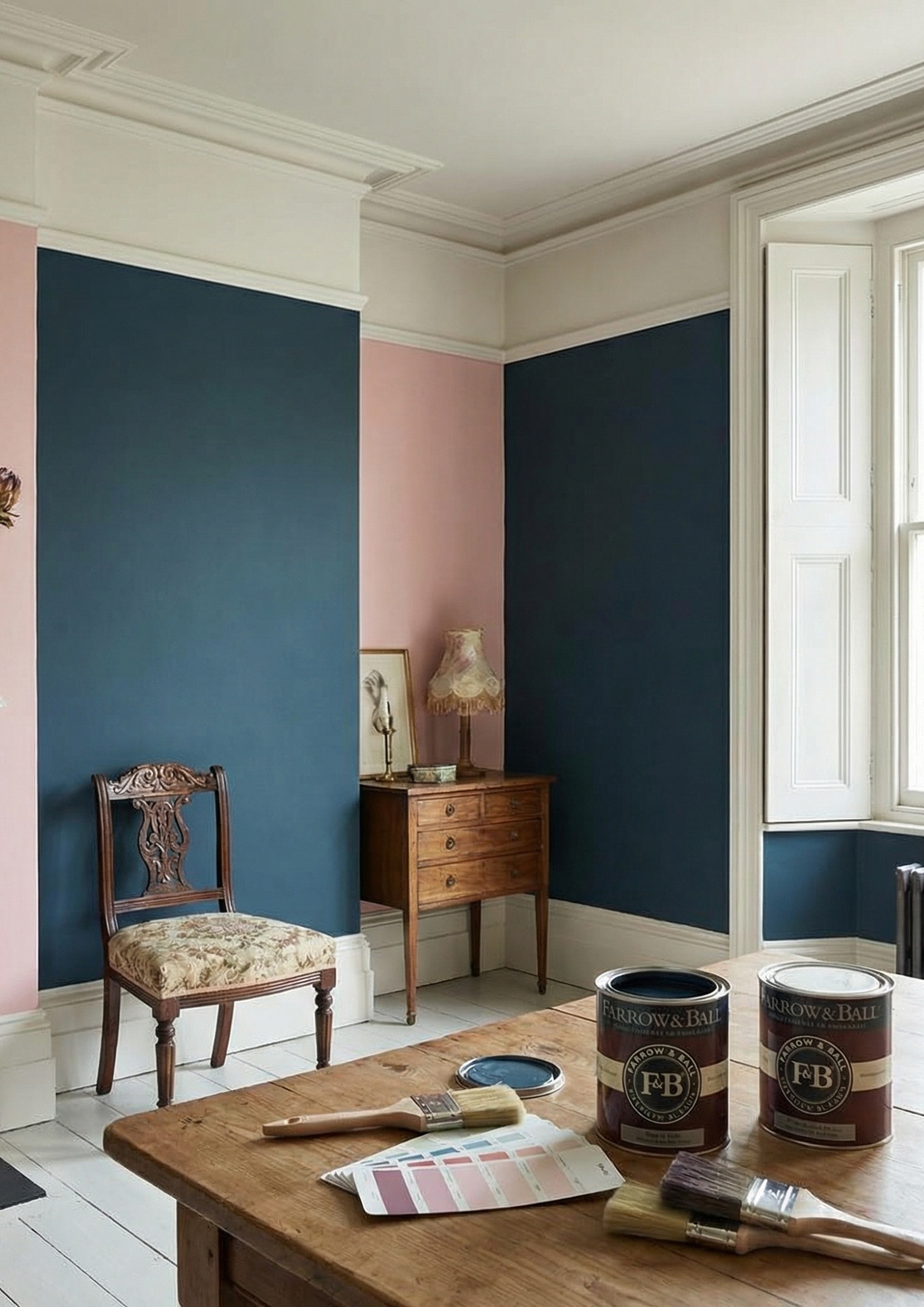 Interior room with teal and pink painted walls, antique chair, wooden dresser with lamp, and paint cans.