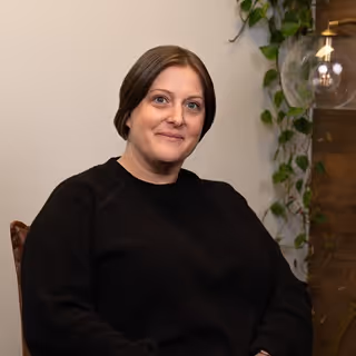 Professional headshot of Teresa, Activate team member, against neutral background