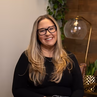 Professional headshot of Bre, Activate team member, showing enthusiasm